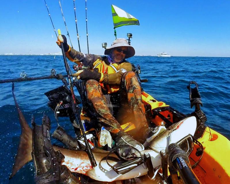 Freshly gaffed Cobia being held down until it can be spiked.